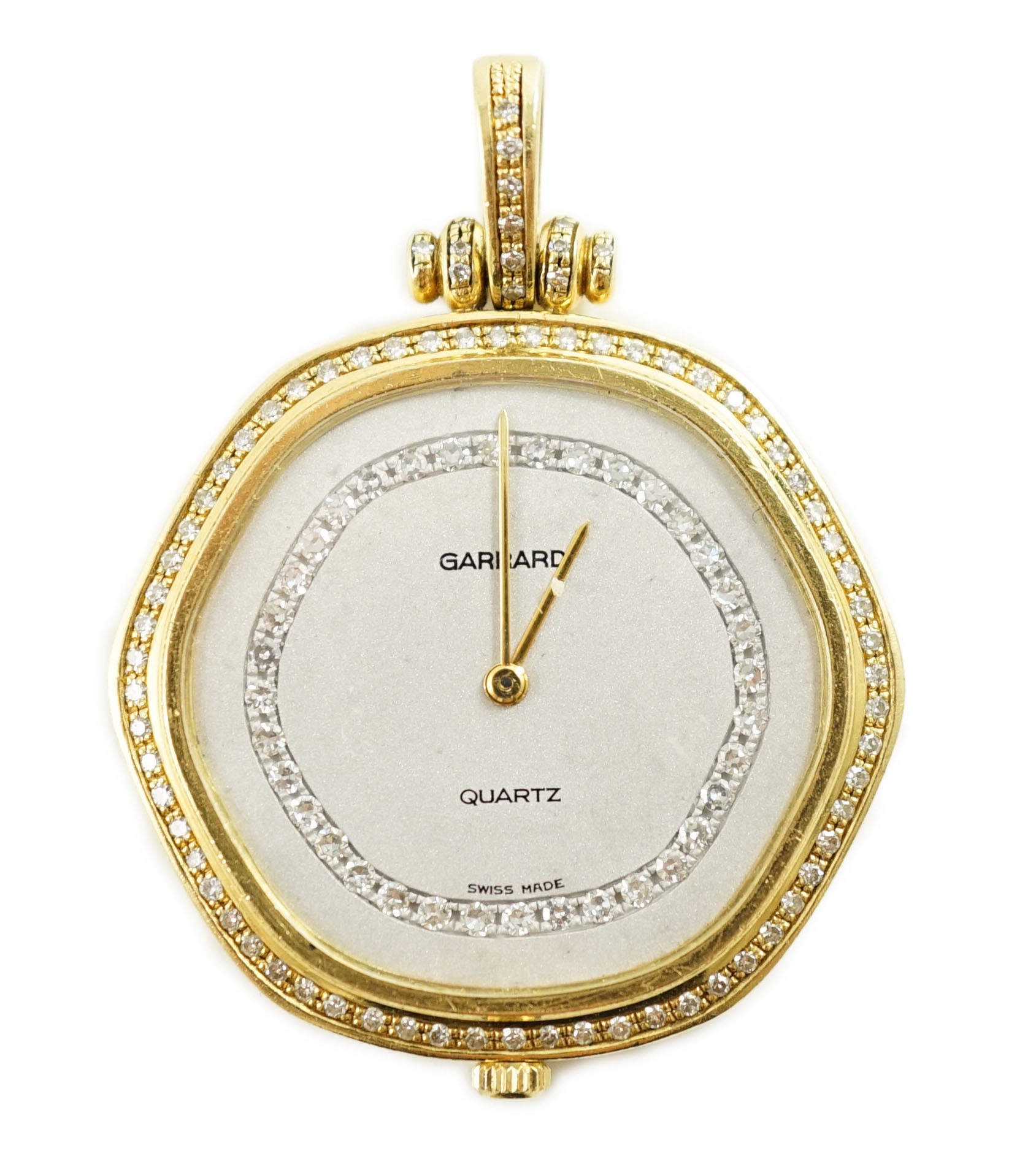 A modern 18ct gold and diamond set quartz shaped hexagonal pendant dress watch, retailed by Garrard